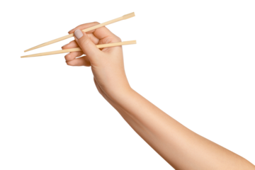 A woman's hand holds wooden chopsticks for sushi or rolls on a blank background.