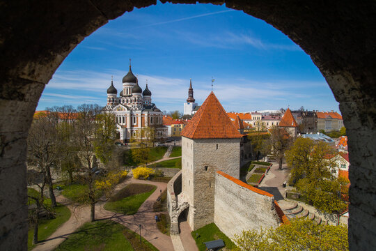 Tallin Estonia Castle view boarder archway postcard image catherdal overlooking city in morning blue sky