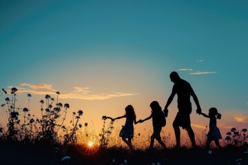 Silhouette of a family walking through a field at sunset. Perfect for illustrating family time, togetherness, and enjoying nature