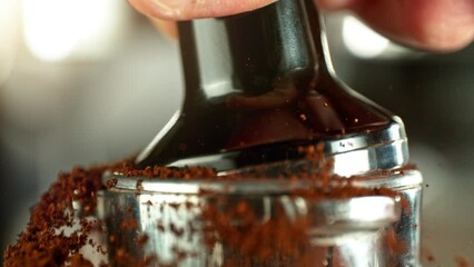 Super Slow Motion of Tamping Ground Coffee. Close-up, Macro Shot, Coffee Machine Accessories. Filmed on High Speed Cinema Camera, 1000fps.