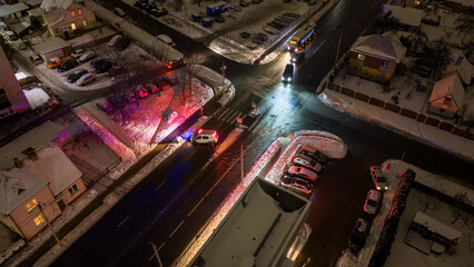 Drone photography of police car restricting accesses to the street due to emergency during winter...