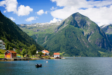 Buildings on the shore of Sognefjord in Balestrand, Norway - 708695295