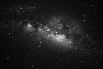 Fototapeta na wymiar A stunning black and white photo capturing the beauty of the Milky Way. Perfect for astronomy enthusiasts or those seeking a sense of wonder.