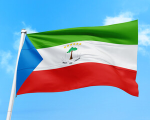 Equatorial Guinea flag fluttering in the wind on sky.