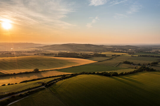 Summer aerial drone landscape image of English countryside surrounding Firle Beacon in South Downs National Park