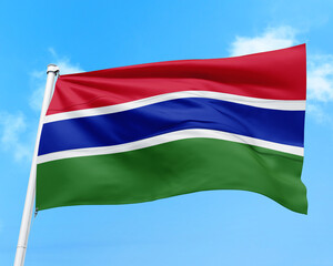 Gambia flag fluttering in the wind on sky.