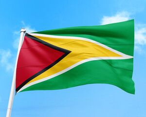 Fototapeta na wymiar Guyana flag fluttering in the wind on sky.
