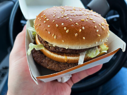 On-the-go McDonald's Lunch: Big Mac on Car Passenger Seat