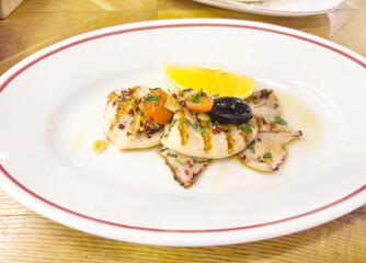 plate with cooked squid on the table