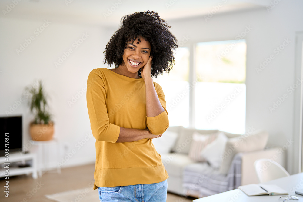 Wall mural portrait of smiling happy young pretty 25 years old african american woman wearing yellow jumper and