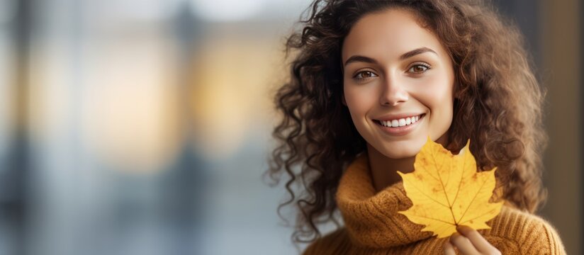 pose of beautiful smiling woman holding leaves