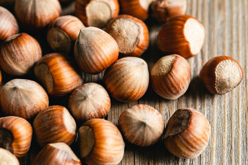 Hazelnuts on a wooden surface, organic natural food, nuts macro, food background.
