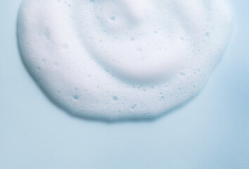 Foam background. Liquid soap bubbles, Froth bubbles backdrop. Soap foam popping bubble, white...