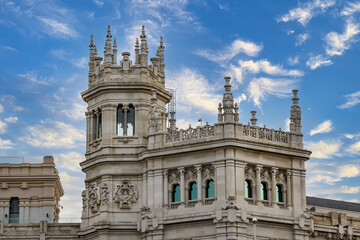 Architectural fragments of Cibeles Palace (Palacio de Cibeles) in Plaza de Cibeles: Madrid City Council (formerly Palace of Communication), iconic monument of the city. MADRID, SPAIN.