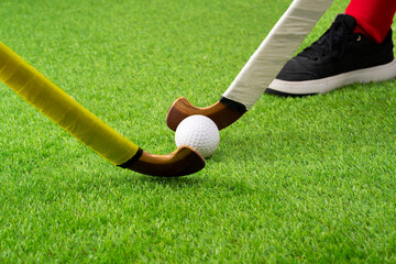Fitness, sports and hockey with men on field and training for competition, challenge and workout. Battle, games and exercise with shoes of hockey player and sticks in stadium for workout and health.
