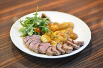rosemary duck breast steak with vegetables and caramelized fruit