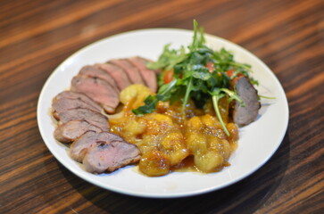 rosemary duck breast steak with vegetables and caramelized fruit