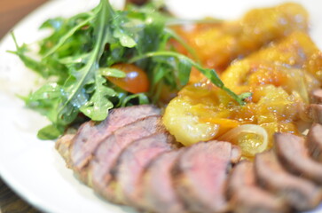 rosemary duck breast steak with vegetables and caramelized fruit