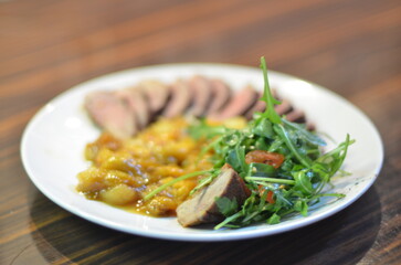 rosemary duck breast steak with vegetables and caramelized fruit