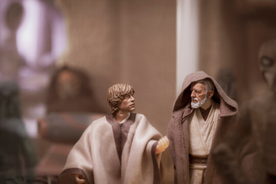 NEW YORK USA: AUGUST 2 2020: recreation of a scene from Star Wars A New Hope where Luke Skywalker and Obi Wan Kenobi are at Mos Eisley spaceport - Hasbro action figure