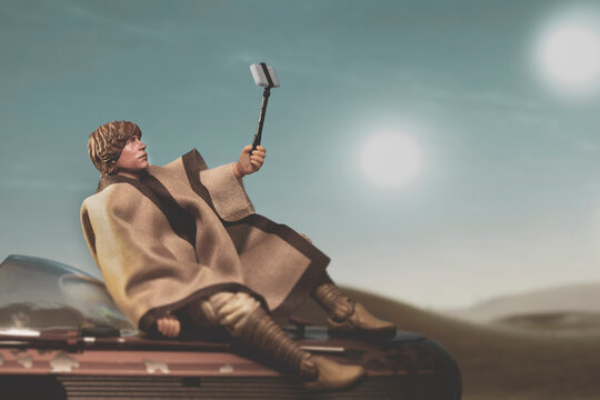 NEW YORK USA: AUGUST 2 2020: a humorous scene from Star Wars A New Hope where Luke Skywalker takes a selfie on Tatooine - Hasbro action figure