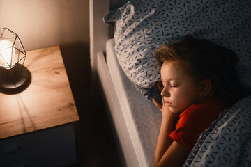 Child sleeping at night. Comfortable bed for kids. Toddler girl sleeping tight, fast falling...