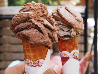Gelatto ice cream in waffle cone on street food market, Indonesia.