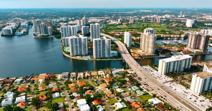 Breath-taking view on the sunny green urban area divided by the waterscape. Panorama of Miami, Florida, USA.