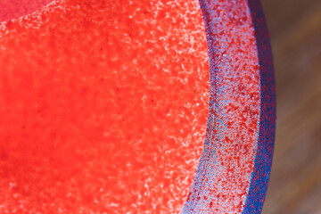 Confectioner decorates the cake with velour using the spray gun.