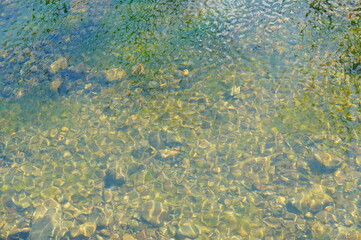 shinny pebbles in the water