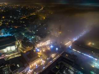 Mysterious smoggy Novi Sad aerial view in winter night, Serbia