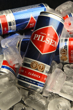 Pilsen beer cans on ice.