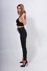 Fototapeta premium Beautiful boudoir female model holding vintage shotgun full length