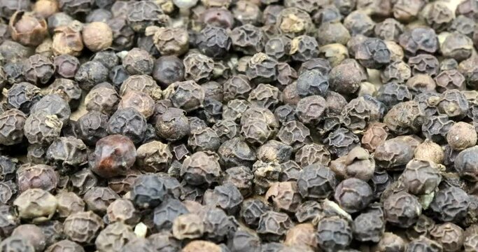 Video close-up of peppercorns in rotating motion