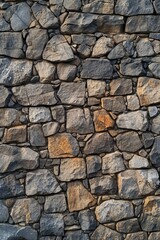 Fototapeta premium A brick wall made of various rocks and stones
