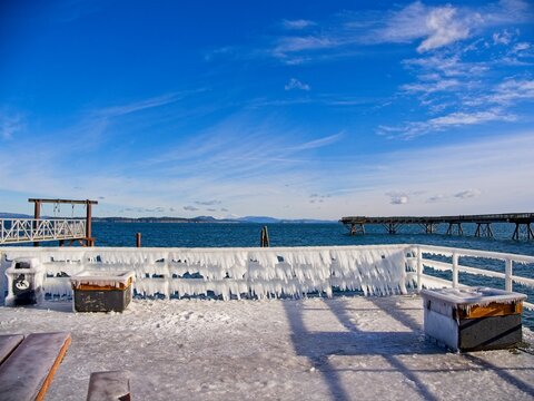 Ice covers rails of a pier in Sidney BC during unusual cold snap