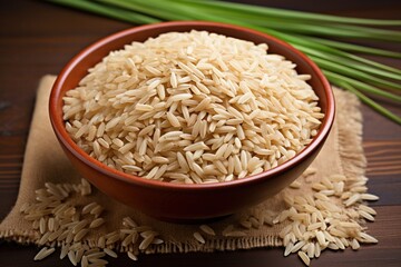 Brown rice in a bowl on a wooden table