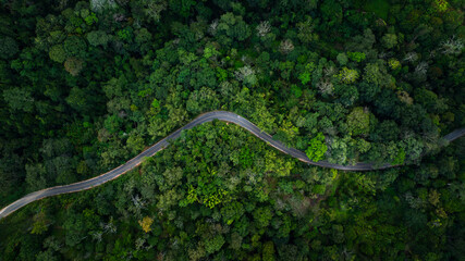 aerial view form drone winding road in the green valley in the north of thailand,
