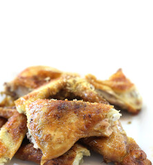 Grilled chicken with herbs on a white background