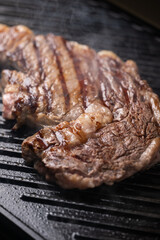 ribeye steak on hot smokey grill