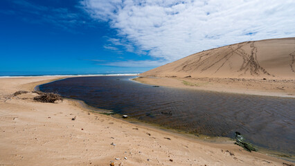 Slang river and the big dune at Oyster Bay Beach, Eastern Cape, South Africa