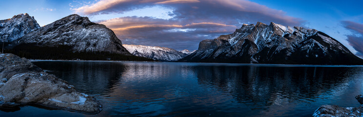 Winter sunset panorama by Lake with Mountains 