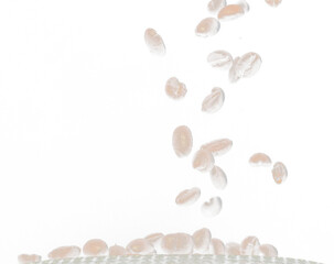 Roasted Coffee seeds with smoke. Beans Coffee roasted on pile and hot smoke raise up in line shape. Roasted coffee bean create scent aroma. Black background isolated