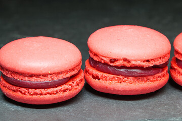 Pink Macarons Closeup on Dark Background