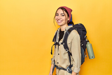 Adventurous Caucasian woman with backpack and canteen