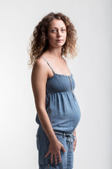 Future mom cradles belly, peaceful and happy