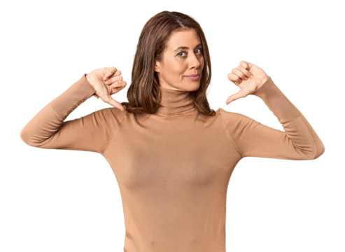 Middle-aged woman portrait in studio setting feels proud and self confident, example to follow.