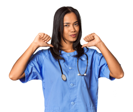 Young Filipina nurse posed in studio feels proud and self confident, example to follow.