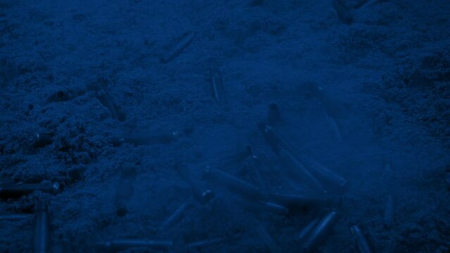 Bullet Casings On Sand At Night War Scene
