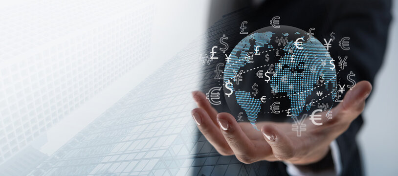 Currency exchange, money transfer, FinTech financial technology, Global business, online banking, interbank payment concept. Businessman holding global network with foreign currency, e-transaction